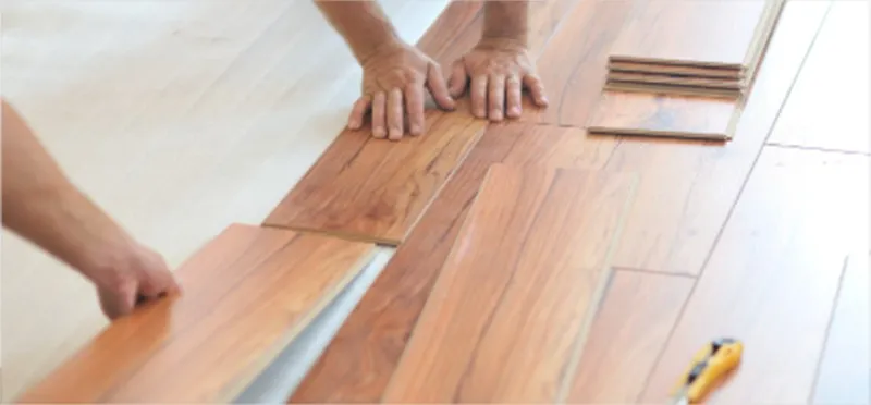 Professionals installing floor | Custom Floors and Custom Stone
